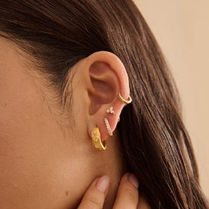 MURKANI Cosmic Love Huggie With White Topaz - 18KT Yellow Gold Plate Earrings - Zabecca Living