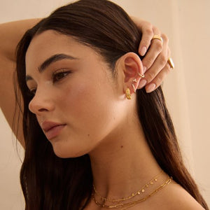 MURKANI Cosmic Love Huggie With White Topaz - 18KT Yellow Gold Plate Earrings - Zabecca Living
